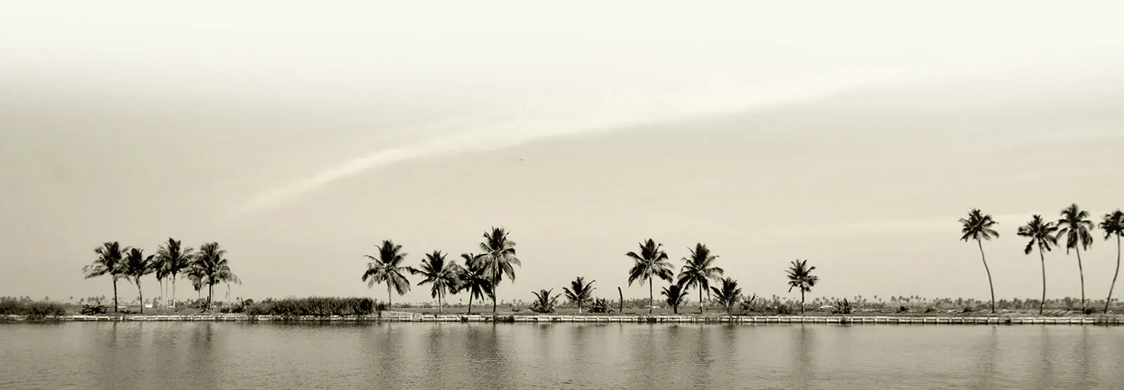 Sunset over a Kerala lake villa