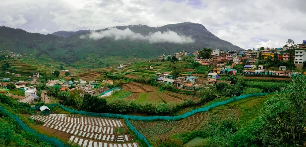 Terraced valley and misty highlands surrounding Vattavada